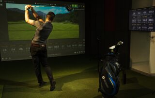 Golf swing practice in action in Next Level Golf indoor virtual golf studio with Trackman technology - Why TrackMan 4 Powers the Future of Indoor Golf blog post